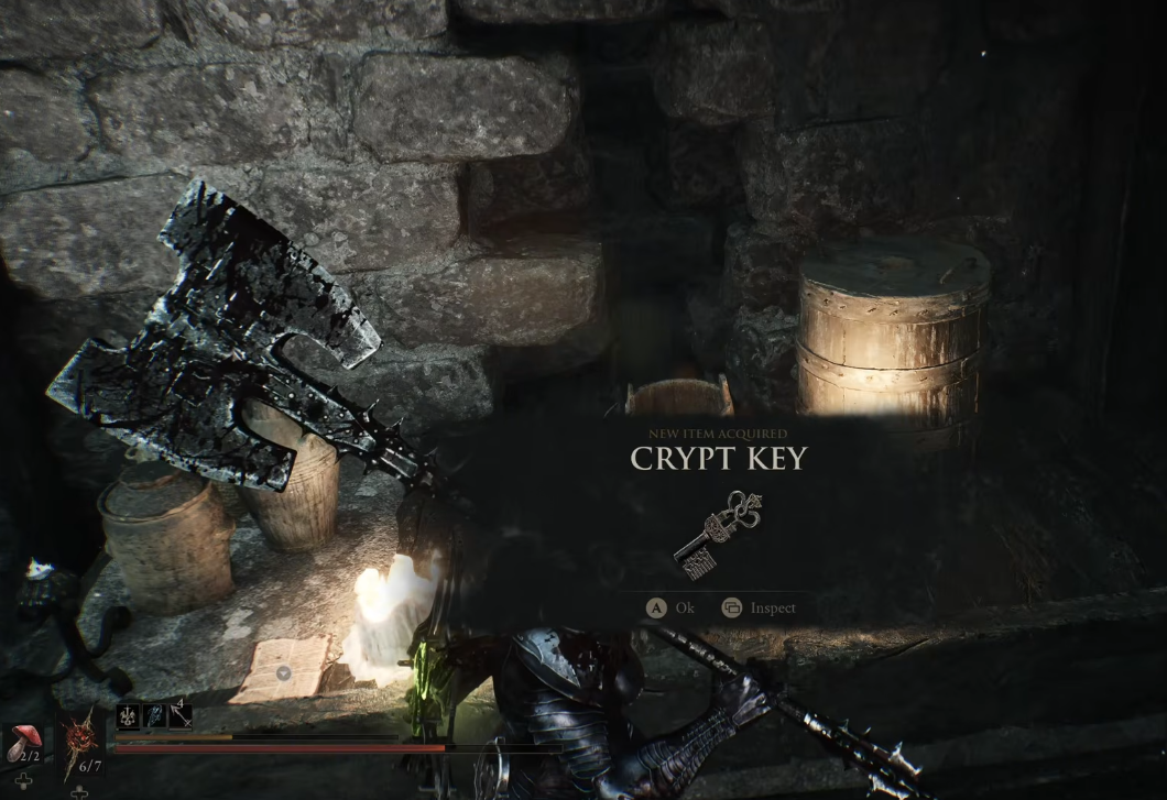 Повідомлення про отримання предмета "Crypt Key" (Ключ від склепу) у Mortal Shell поруч із сокирою
